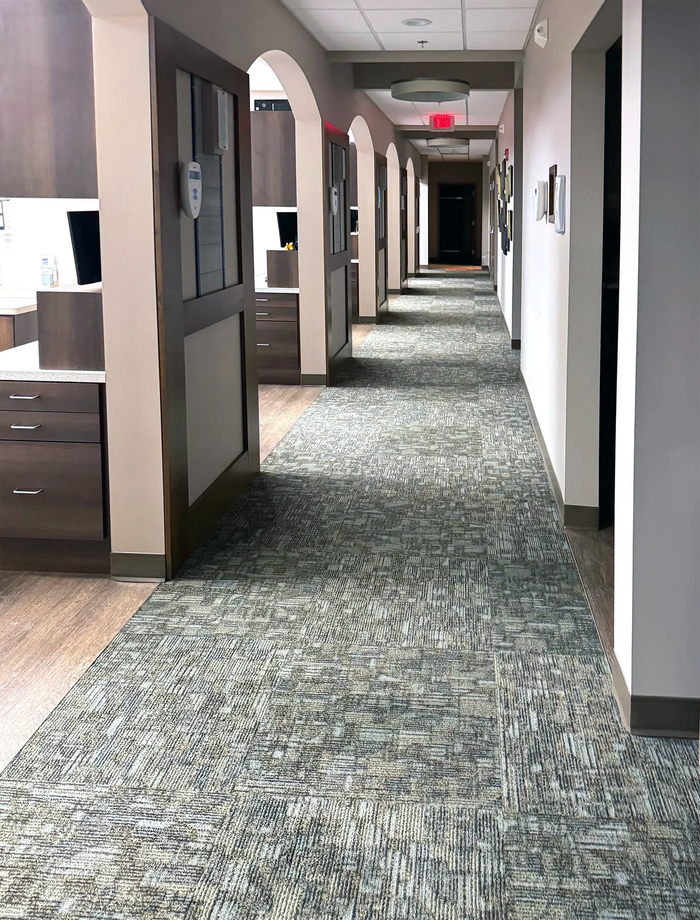 Freshly vacuumed commercial hallway in an office building cleaned by Solutions Cleaning